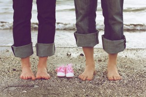 Pregnancy Announcement with Baby Shoes
