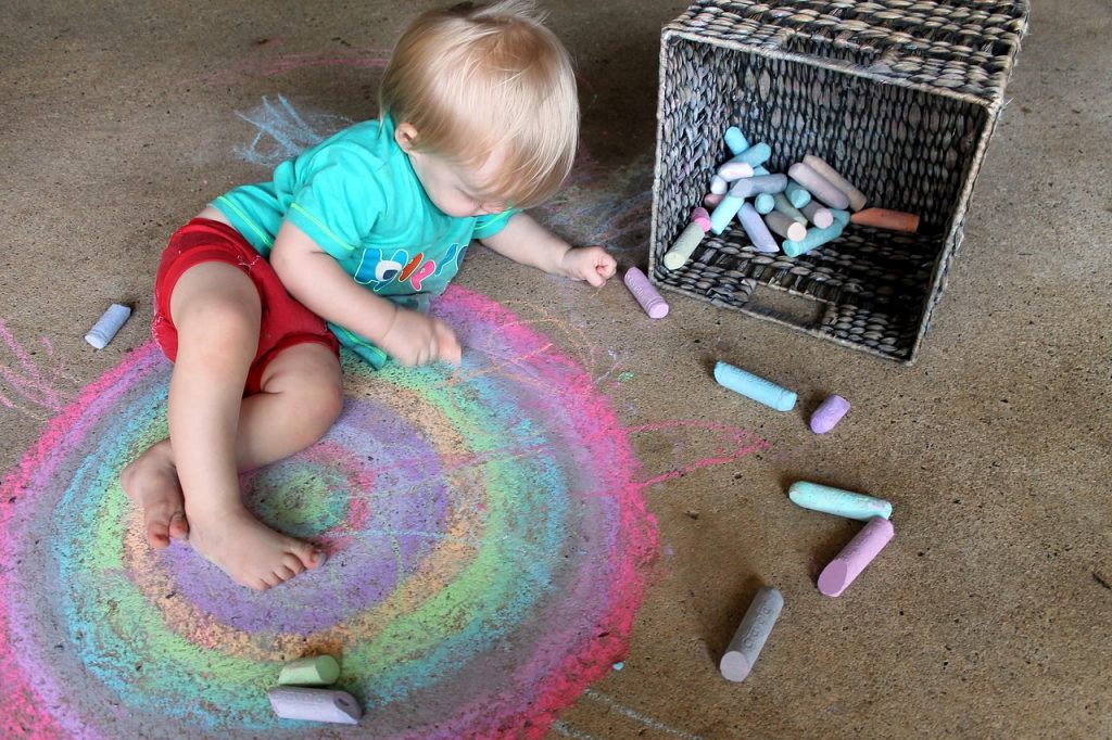 Baby drawing rainbow